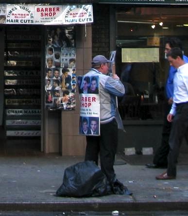 Man Wearing Barbershop Sign in Times Square
